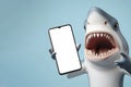 Shocked Shark holding smartphone with white mockup screen on solid color background. ai generative