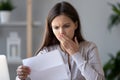 Shocked stressed young woman reading document letter about debt Royalty Free Stock Photo