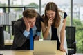 Shocked and stressful Business people looking at the laptop miserably Royalty Free Stock Photo