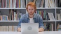 Shocked, Stunned Man with Red Hairs Working on Laptop Royalty Free Stock Photo