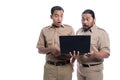 Shocked and suprised worker while looking at laptop together Royalty Free Stock Photo