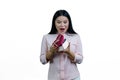 Shocked and surprised asian woman is opening a heart-shaped gift box. Royalty Free Stock Photo