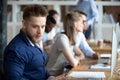 Shocked businessman amazed by reading unbelievable news