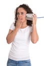 Shocked and surprised isolated young woman listening on tin can Royalty Free Stock Photo