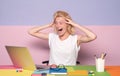 The shocked teacher use notebook in the classroom on color background. Teaching and people learning concept. Deadline Royalty Free Stock Photo