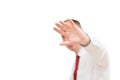 Shocked and terrified man forbids taking pictures of himself. Portrait of young man in shirt and red tie covering his