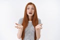 Shocked unsatisfied cute redhead girl raise hands dismay questioned open mouth wide eyes surprised expectations let down