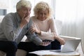 Shocked upset retired older couple counting overspent budget Royalty Free Stock Photo