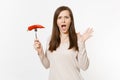 Shocked vegan woman holds in hand red hot chili pepper on fork isolated on white background. Proper nutrition Royalty Free Stock Photo