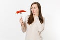 Shocked vegan woman holds in hand red hot chili pepper on fork isolated on white background. Proper nutrition Royalty Free Stock Photo