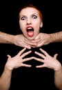 Shocked woman on black background