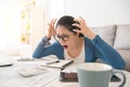 Shocked woman checking expensive bills Royalty Free Stock Photo