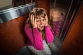 Shocked woman with claustrophobia in the moving elevator Royalty Free Stock Photo