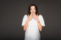 shocked woman covering mouth with hands Royalty Free Stock Photo