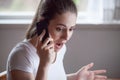 Shocked woman devastated by bad news heard over phone Royalty Free Stock Photo