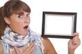 Shocked woman with empty photo frame Royalty Free Stock Photo