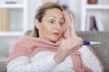 shocked woman with fever checking temperature Royalty Free Stock Photo