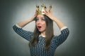 Shocked woman with golden crown. First place concept. Royalty Free Stock Photo