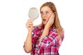 Shocked woman looking into mirror Royalty Free Stock Photo
