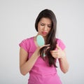 Shocked woman losing hair on hairbrush Royalty Free Stock Photo