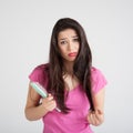 Shocked woman losing hair on hairbrush Royalty Free Stock Photo