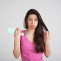 Shocked woman losing hair on hairbrush Royalty Free Stock Photo