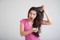 Shocked woman losing hair on hairbrush Royalty Free Stock Photo