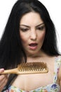 Shocked woman loss hair on hairbrush Royalty Free Stock Photo