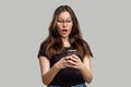 Shocked woman portrait overwhelming news phone