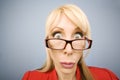 Shocked woman in red making a funny face Royalty Free Stock Photo
