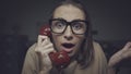 Shocked woman talking on the phone Royalty Free Stock Photo