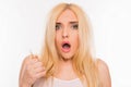 Shocked young blonde holding her damaged hair Royalty Free Stock Photo