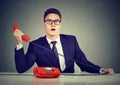 Shocked business man receiving bad news on the phone Royalty Free Stock Photo