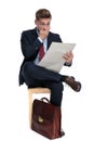 Shocked young businessman reading newspaper in studio Royalty Free Stock Photo