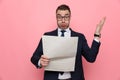 Shocked young businessman reading newspaper Royalty Free Stock Photo