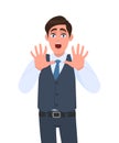 Shocked young businessman shouting and making stop gesture with hands. Trendy person afraid and terrified with fear expression.