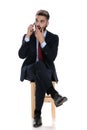 Shocked young businessman talking on the phone Royalty Free Stock Photo