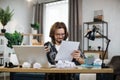 Shocked young caucasian man sitting at table with modern laptop at home office Royalty Free Stock Photo