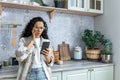 Shocked young Latin American woman received bad news on the phone, a message from a doctor Royalty Free Stock Photo