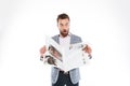 Shocked young man reading gazette. Royalty Free Stock Photo