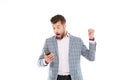Shocked young man using mobile phone. Royalty Free Stock Photo