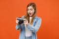 Shocked young woman girl in casual denim clothes posing isolated on orange background studio portrait. People sincere Royalty Free Stock Photo