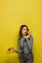 shocked young woman holding retro telephone Royalty Free Stock Photo