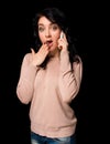 Shocked young woman talking on cell phone Royalty Free Stock Photo