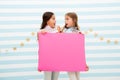 Shocking announcement concept. Amazing surprising news. Girl hold advertising banner. Girls kids holding paper banner Royalty Free Stock Photo