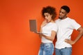 Shocked black millennial couple browsing on laptop Royalty Free Stock Photo