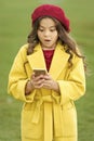 Shocking content. Little girl using mobile phone. Small girl child checking news feed. Child learning new technology