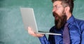 Shocking information. Hipster teacher wear eyeglasses and necktie holds laptop surfing internet. Shocking news. Teacher