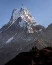 Shocking view of Fish Tail peak and two trekkers as seen from Mardi Himal trekking