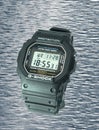 Shockproof and waterproof digital electronic watch in a rubber case and a glass screen Royalty Free Stock Photo